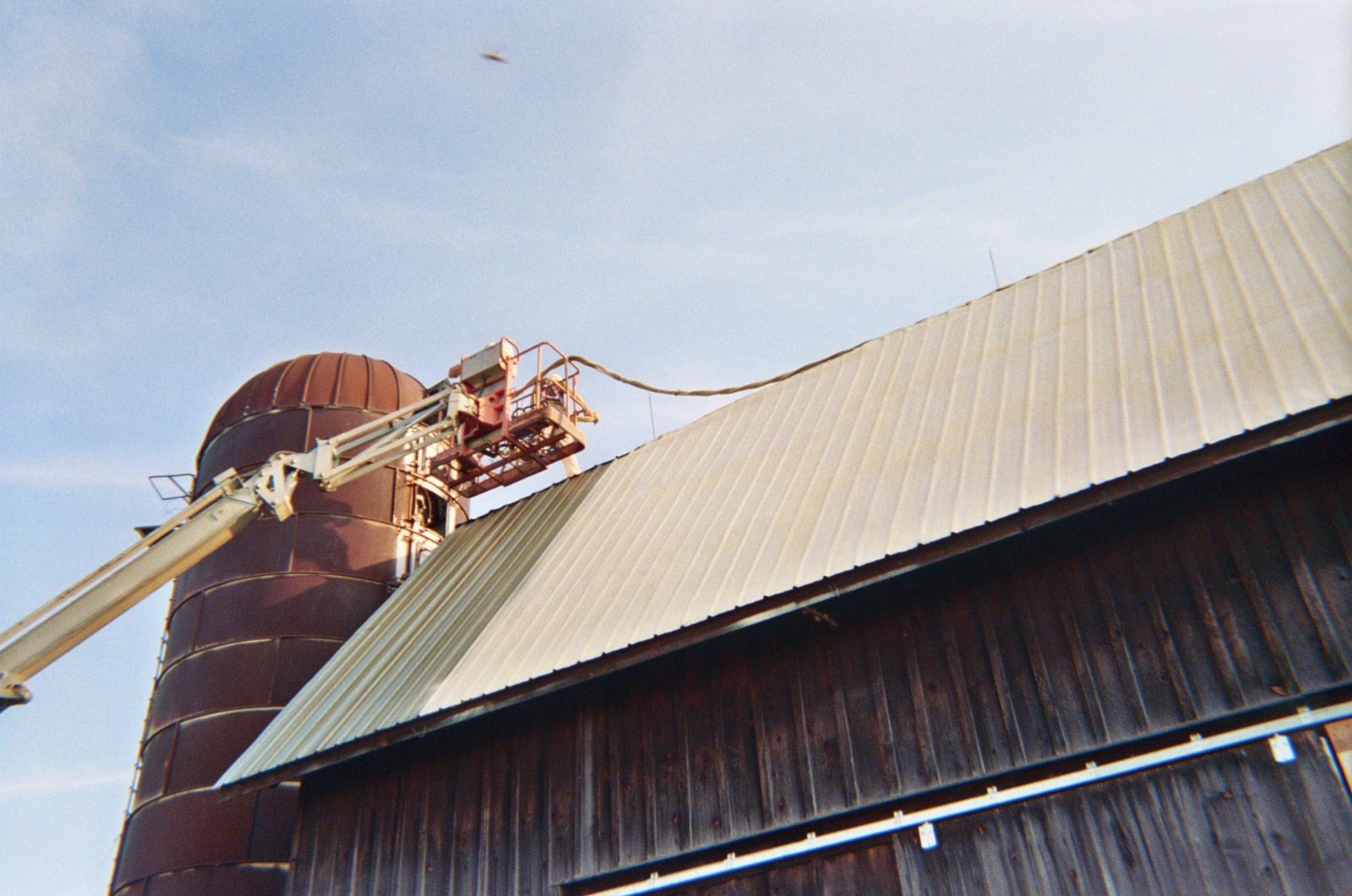 Spray foam roofing applied to a low-slope building deck