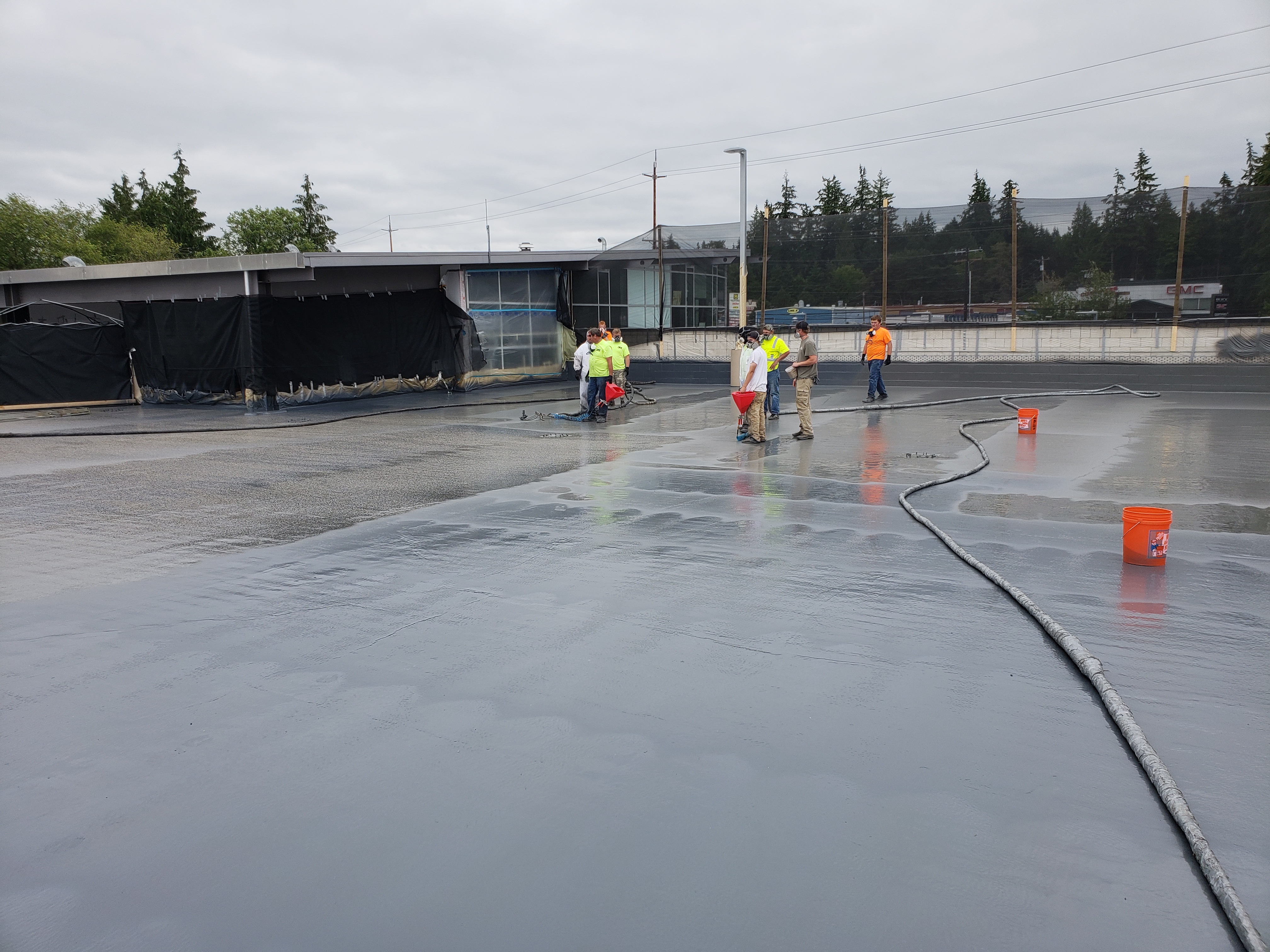 Low-slope commercial roof restored with sprayed polyurea membrane